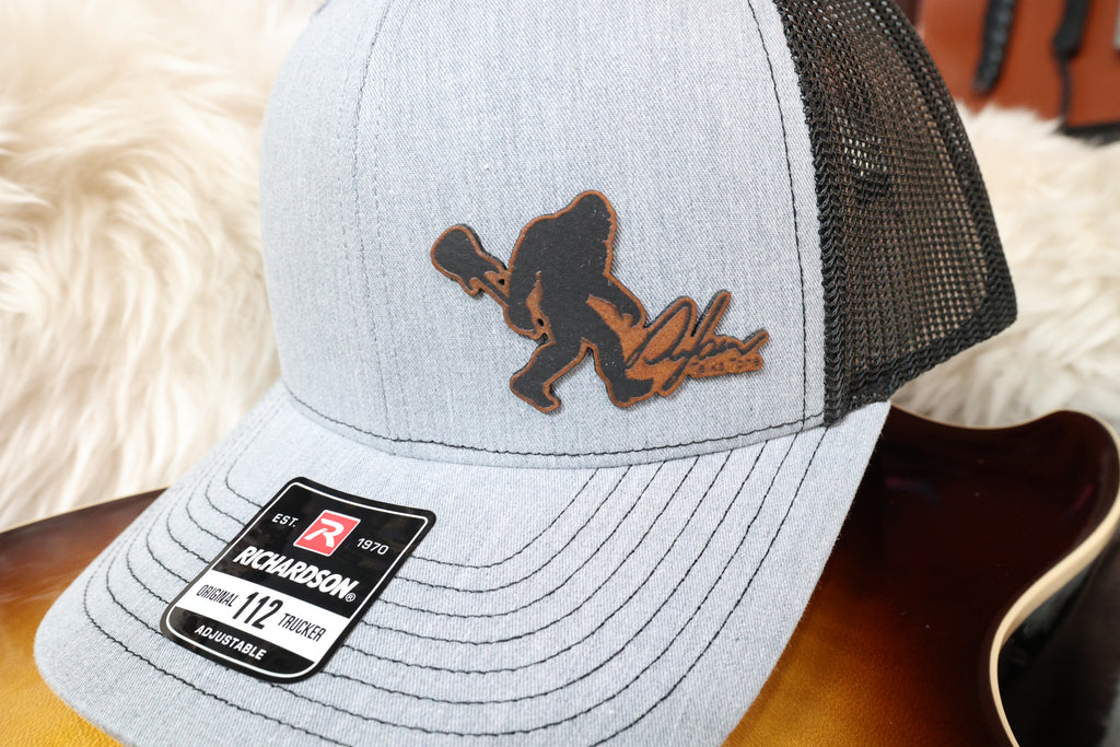 gray hat with brown Sasquatch leatherette patch with Dylan logo