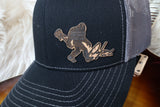 black hat with brown Sasquatch cork patch with Dylan logo